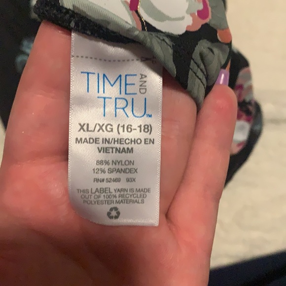 A one-piece bathing suit with a keyhole back and two little peek-a-boo holes - Picture 3 of 4